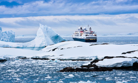 Big cruise ship in the Antarctic waters (Photo via goinyk / iStock / Getty Images Plus)