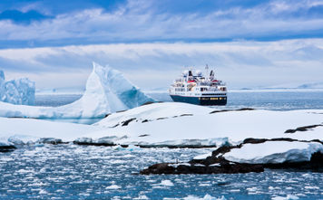 Big cruise ship in the Antarctic waters (Photo via goinyk / iStock / Getty Images Plus)