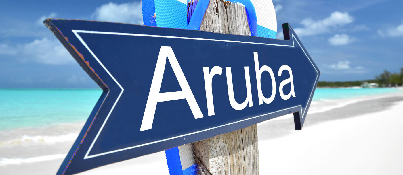 Aruba sign on the beach (Photo via Pincasso / iStock / Getty Images Plus)