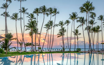 Caribbean Sea views over the main pool at Club Med Mich&#233;s Playa Esmeralda, Dominican Republic.