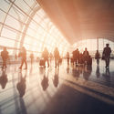 Crowd of travelers inside an airport terminal