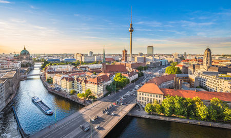 Aerial view of Berlin skyline with famous TV tower and Spree river in beautiful evening light at sunset, Germany. (photo via bluejayphoto/iStock/Getty Images Plus)