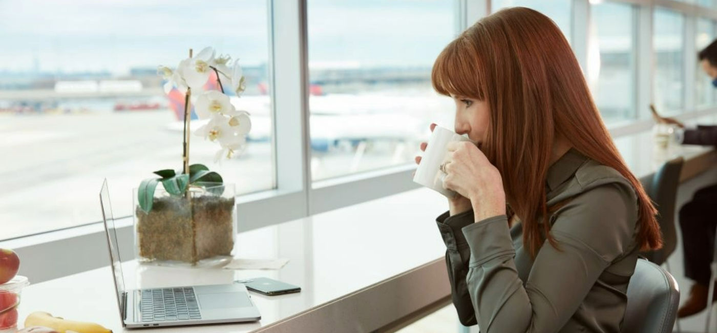 Image: A business traveler inside a Delta SkyClub. (Photo Credit: Delta Air Lines)