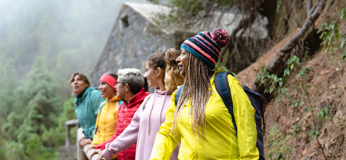 Image: A group of women hiking together. (Photo Credit: Alessandro Biascioli / Adobe Stock)