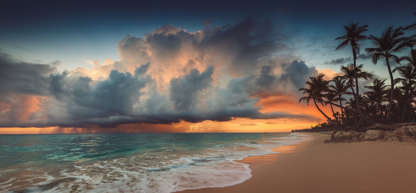 Image: A storm approaching a Caribbean island. (Photo Credit: ValentinValkov/Adobe)