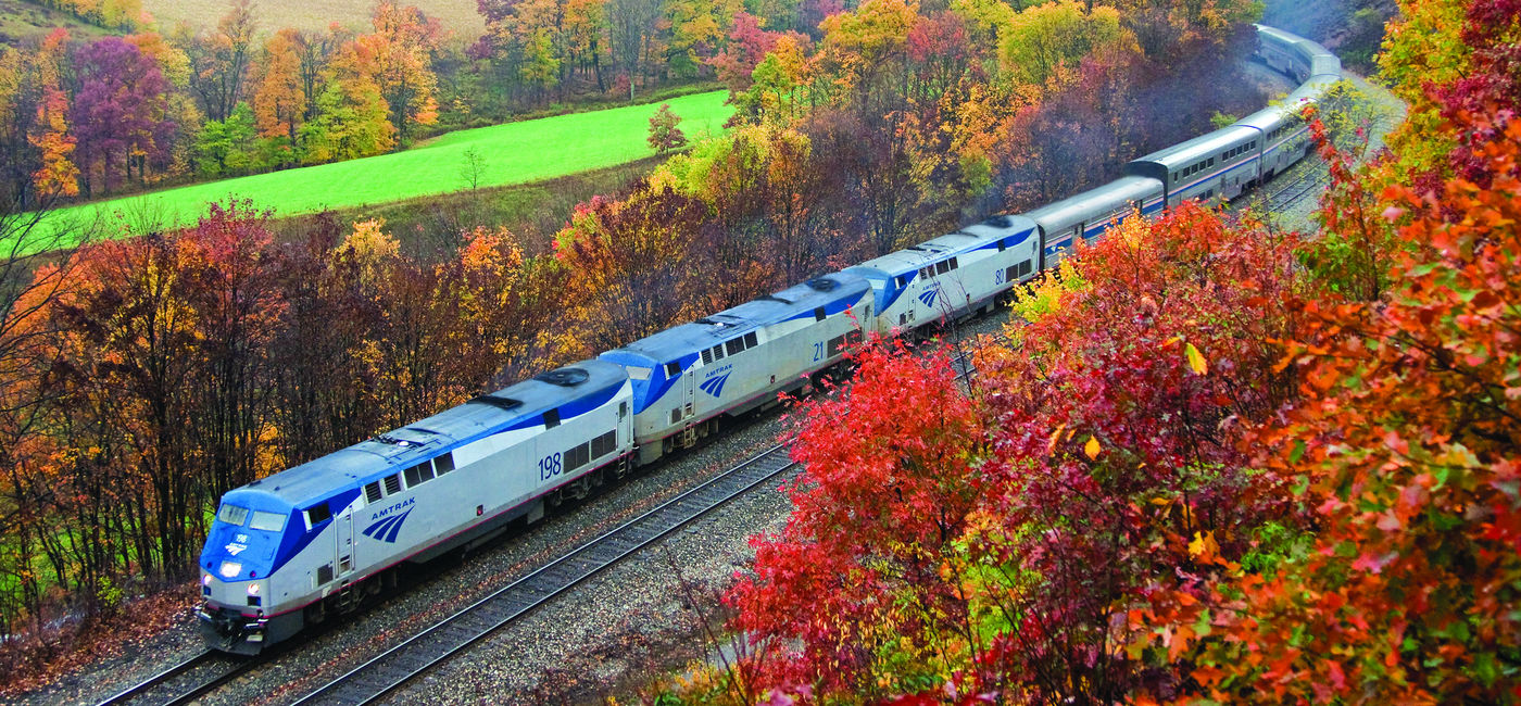 Image: Amtrak's Capitol Limited travels through the Allegheny Mountains between Pittsburgh and Cumberland during peak fall foliage season. (Photo courtesy of Amtrak) (Photo Credit: (photo via Amtrak))