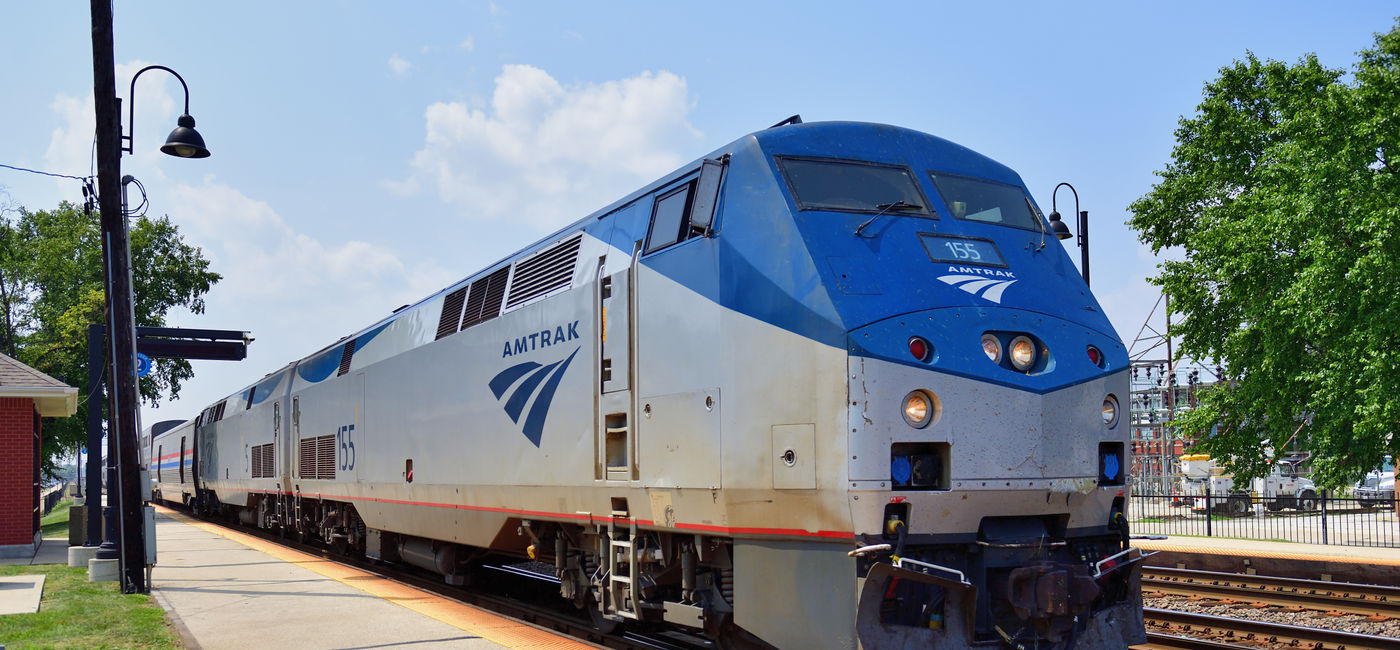 Image: Amtrak train parked at a station. (Photo Credit: Adobe Stock/Bruce Leighty)