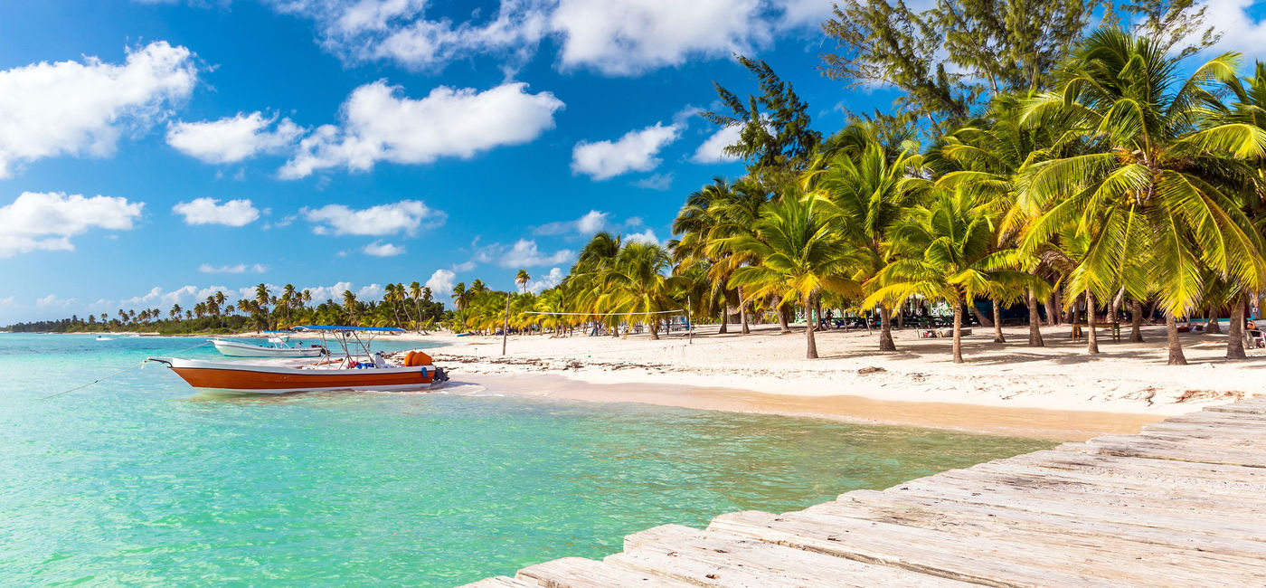 Image: Beautiful Caribbean beach on Saona Island, Dominican Republic. (photo via czekma13 / iStock / Getty Images Plus)