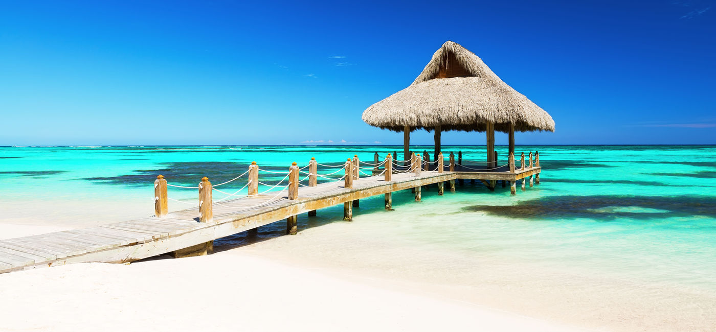 Image: Beautiful gazebo on the tropical white sandy beach in Punta Cana, Dominican Republic (Photo via  Preto_perola / iStock / Getty Images Plus)