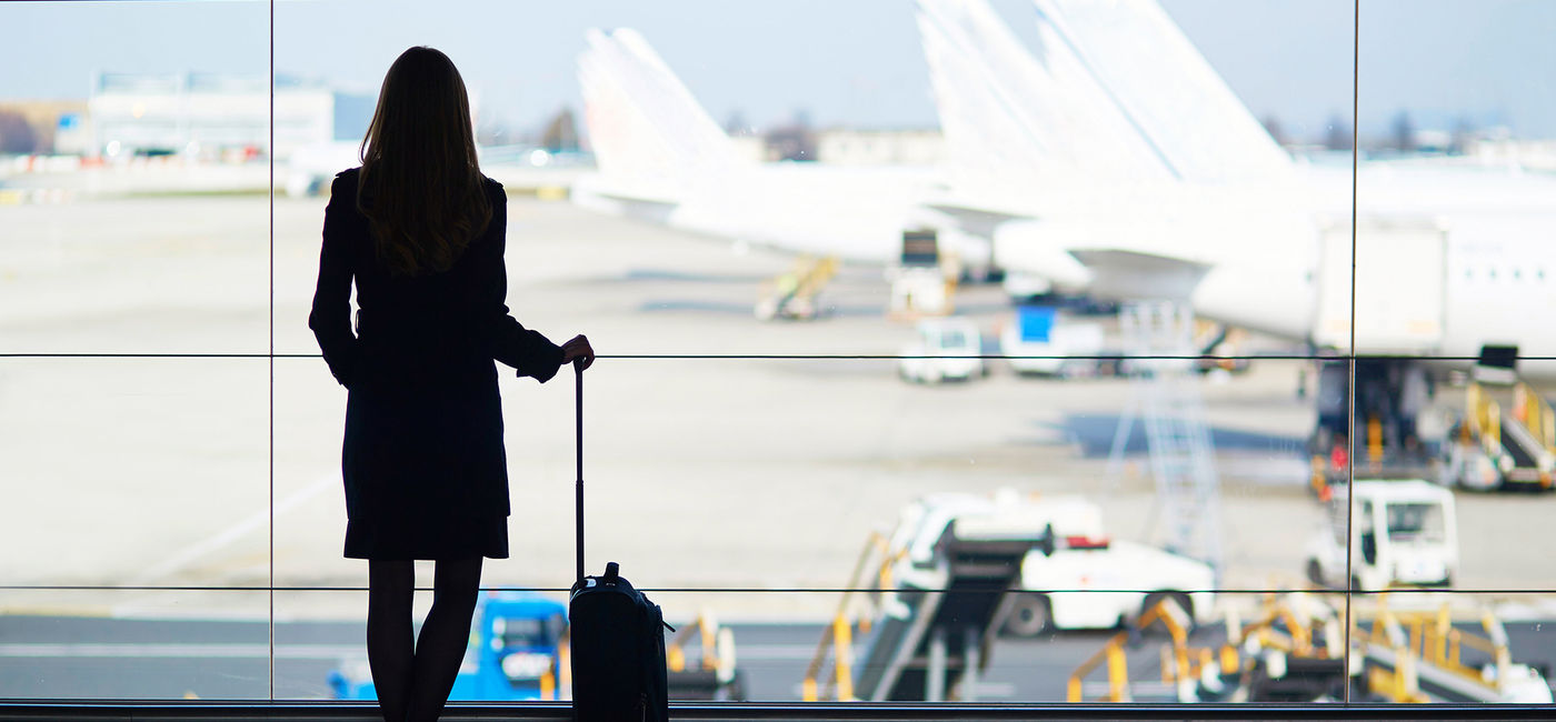 Image: Business traveler at the airport. (photo via encrier/iStock/Getty Images Plus)