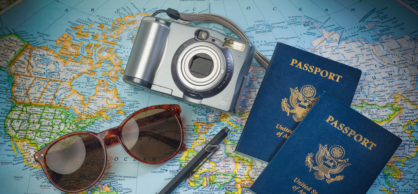 Image: Passports to world travel (Photo Credit: Christian Delbert / Adobe Stock)