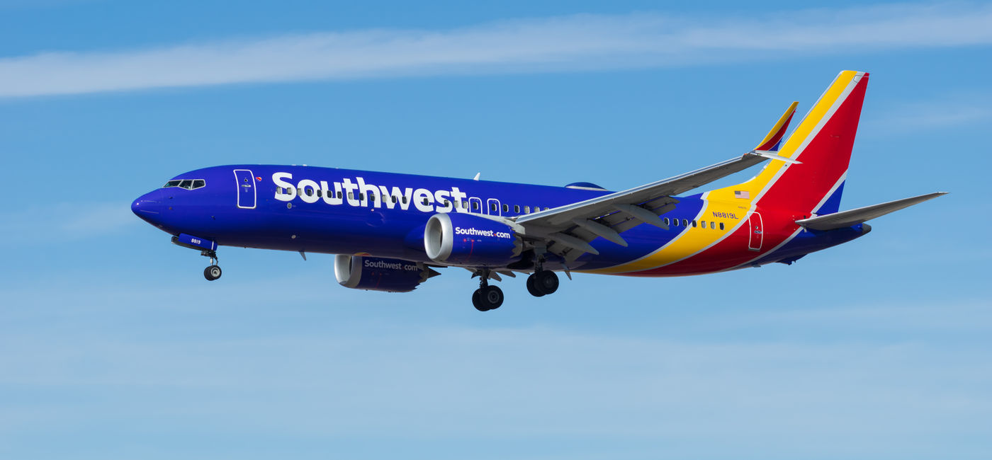 Image: Southwest Airlines Boeing 737 aircraft in flight. (Photo Credit: Adobe Stock/angeldibilio)