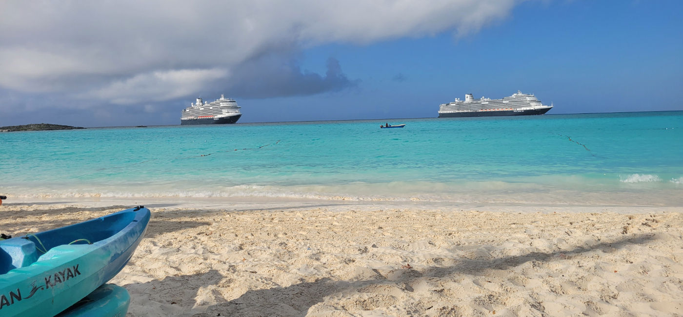 Image: Two Holland America Line ships docked off the coast of Half Moon Cay, the line's private island in The Bahamas. (Photo Credit: Lacey Pfalz)