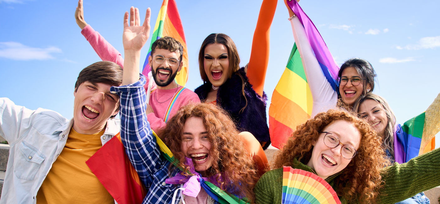 Image: Young people at an LGBTQ+ Pride celebration.  (Photo Credit: Adobe Stock/CarlosBarquero)