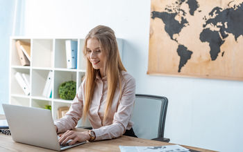 Travel advisor working from a laptop