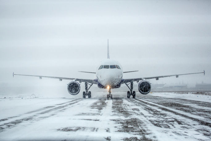 Airliner on runway in blizzard, snow, ice, plane,