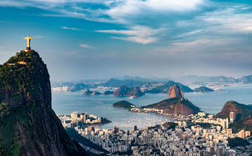 Aerial view of Rio De Janeiro. Corcovado mountain with statue of Christ the Redeemer, urban areas of Botafogo, Flamengo and Centro, Sugarloaf mountain. (photo via microgen / iStock / Getty Images Plus)