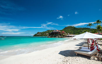 French island in a Caribbean sea (photo via daniloforcellini / iStock / Getty Images Plus)