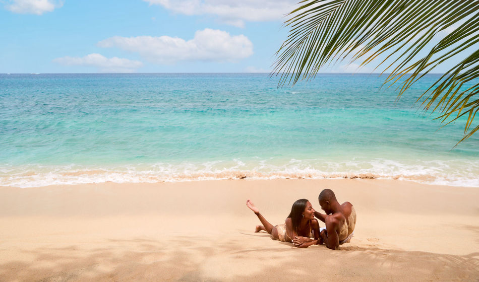 Couple on the beach at Sandals Grenada